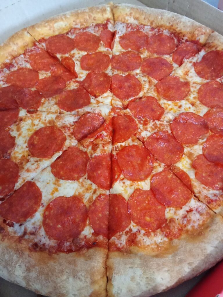 A successful day celebrated by an ordered pizza.